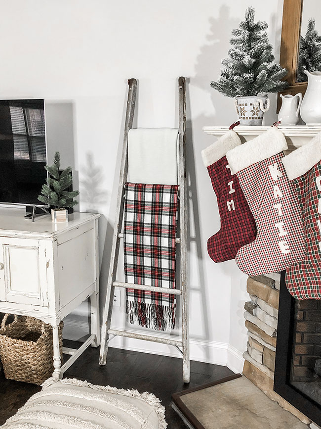 farmhouse christmas, farmhouse table, lorena canals rug, blanket ladder, christmastime, christmas decor, farmhouse decor, decor inspo, ironstone, cozy fire, mom blogger, fireplace, mantle decor, kateschwanke, kate schwanke, kateschwanke blog, christmas stocking, handmade, flocked tree